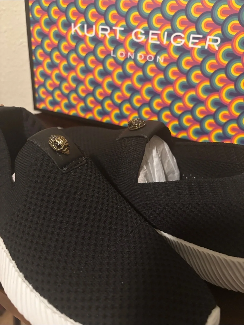 Kurt Geiger Black Knit Slip-On Sneakers with Gold Emblem